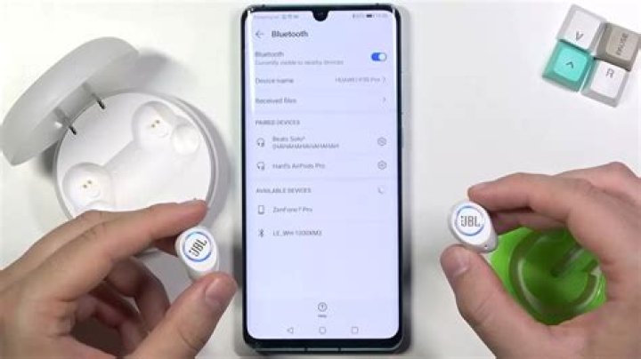 How do I pair my LG headset to my iPhone 11?